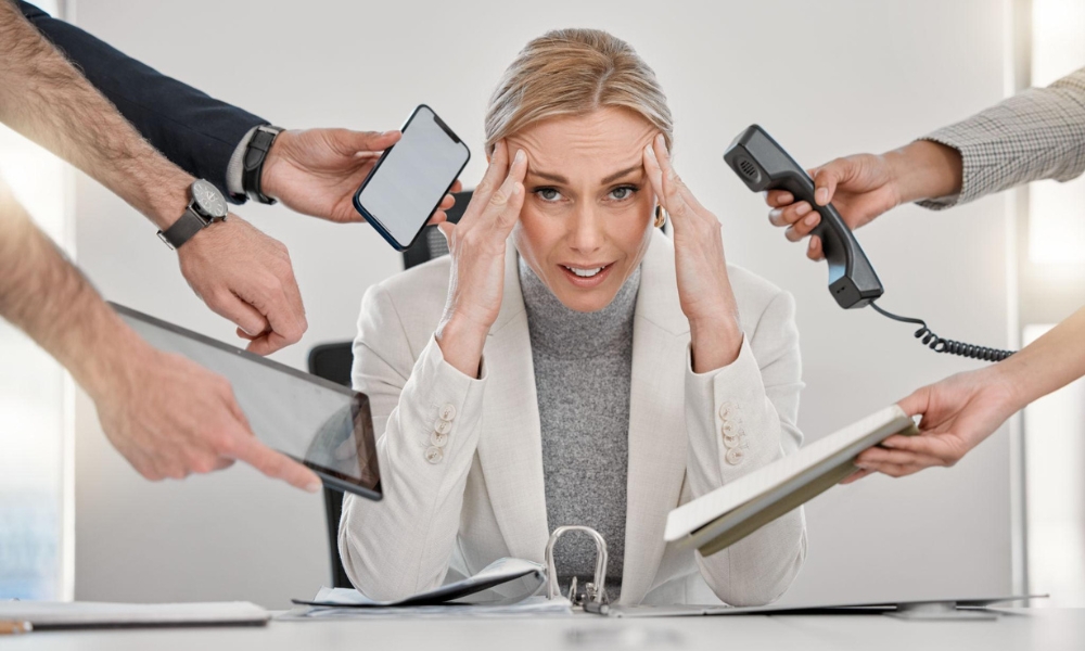Adult experiencing ADHD symptoms while trying to focus on work tasks