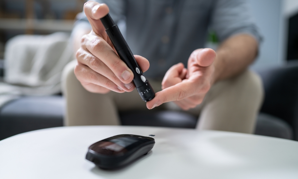 Patient checking high blood sugar levels with a glucose monitoring device