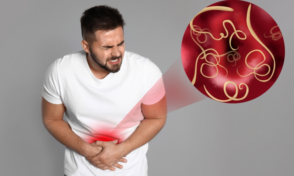 Doctor discussing abdominal pain symptoms with a patient during a medical consultation